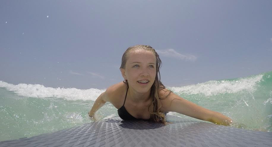 Teenage-Female-Surfer-Catches-Wave-On-Navarre-Beach-Florida